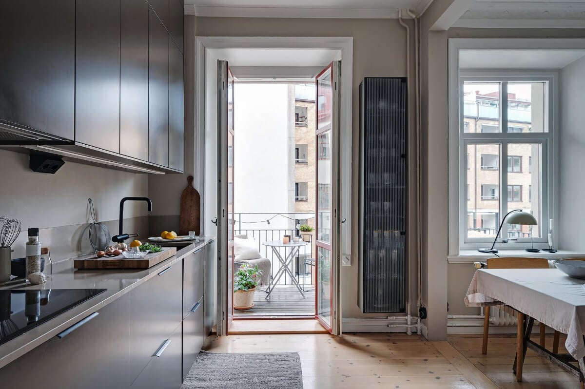 A Gothenburg Apartment with a Small Dark Green Bedroom 16 black kitchen balcony doors