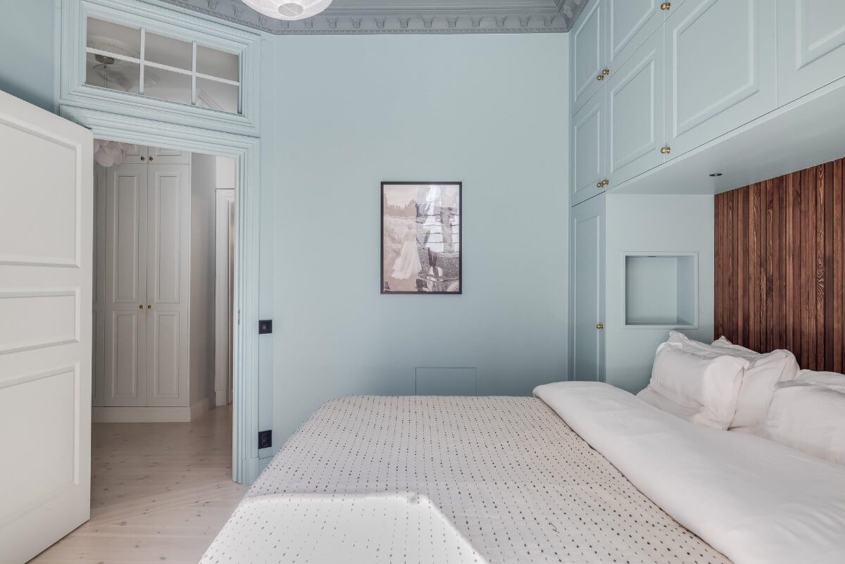 Pastel Colors and Contemporary Design in a Late 19th Century Apartment 17 blue bedroom with window above door