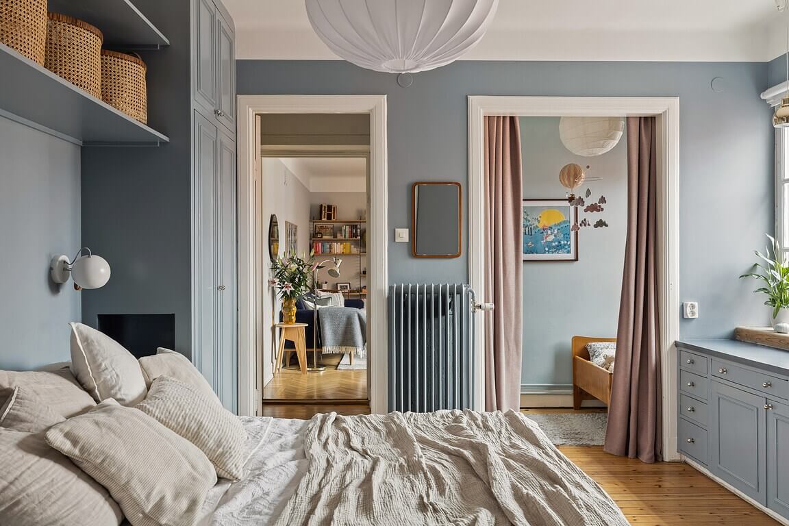 A Stockholm Apartment with a Light Yellow Kitchen 20 blue bedroom