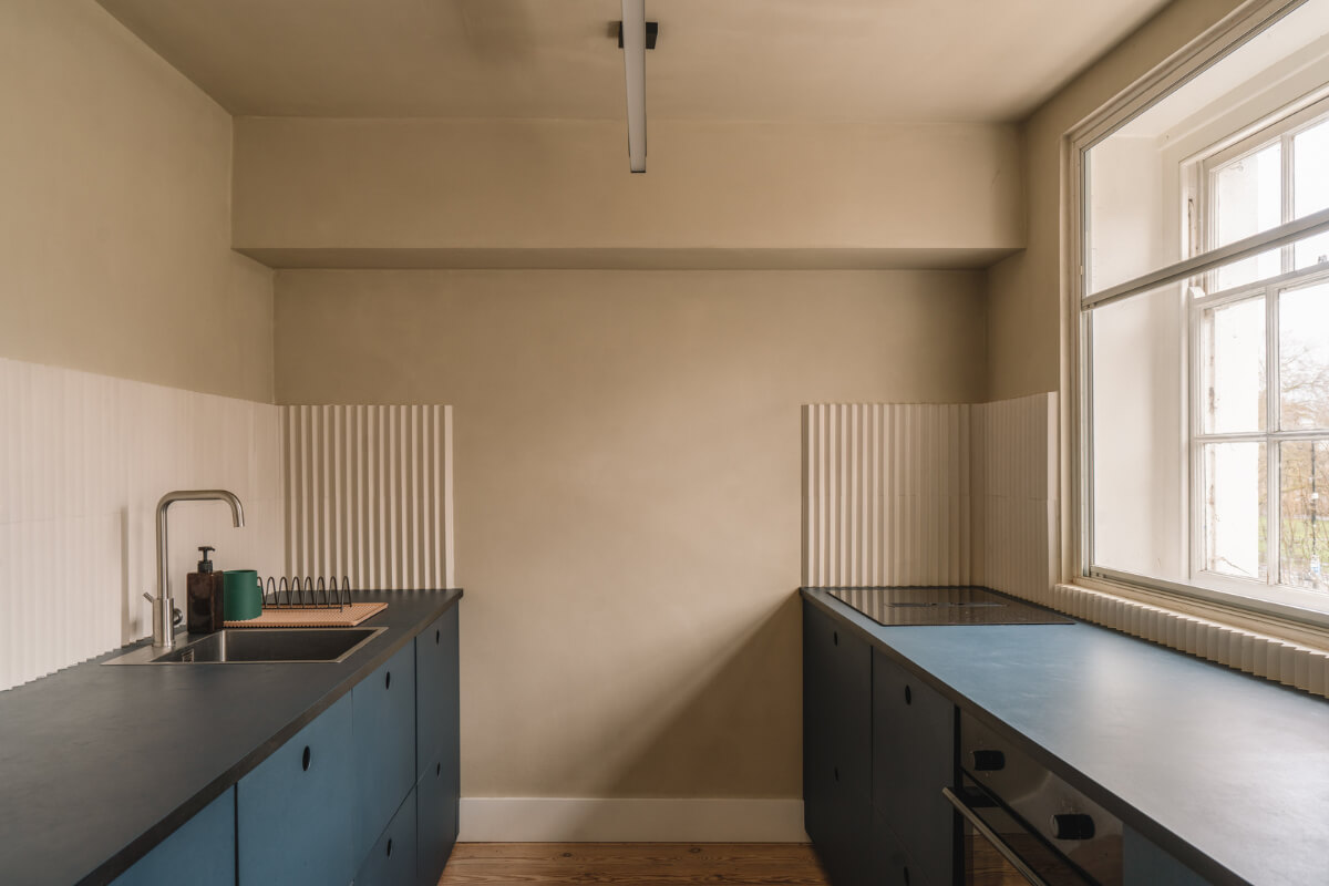 Contemporary Interiors in a Georgian Duplex Apartment in London 7 blue galley kitchen Contemporary Interiors in a Georgian Duplex Apartment in London