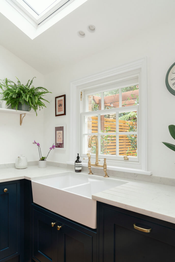 A Renovated Georgian House with an Extended Kitchen 8 blue kitchen butler sink brass fittings