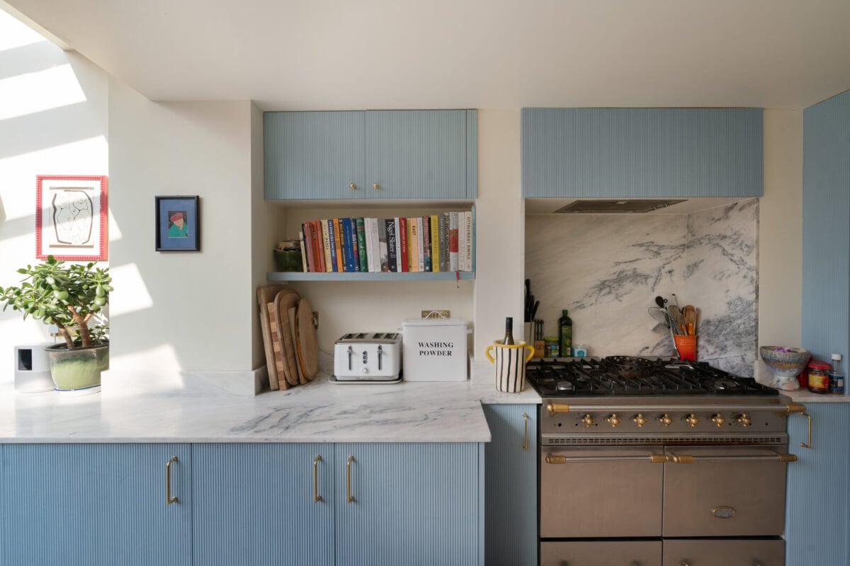 A Bright Victorian House with Plaster Walls and Blue Rooms 8 blue kitchen cabinets
