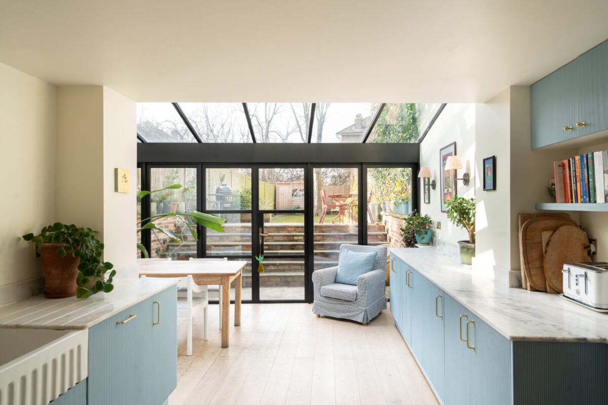A Bright Victorian House with Plaster Walls and Blue Rooms 7 blue kitchen with extension