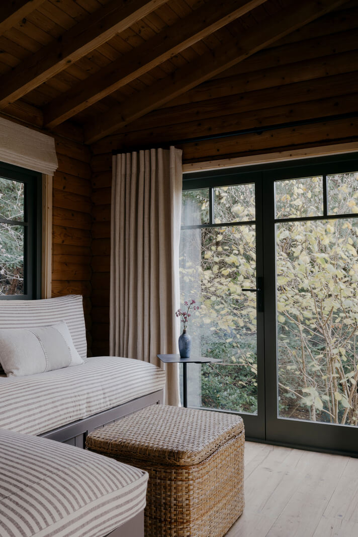A Cozy and Contemporary Take on a Traditional Log House 3 built-in bench seating
