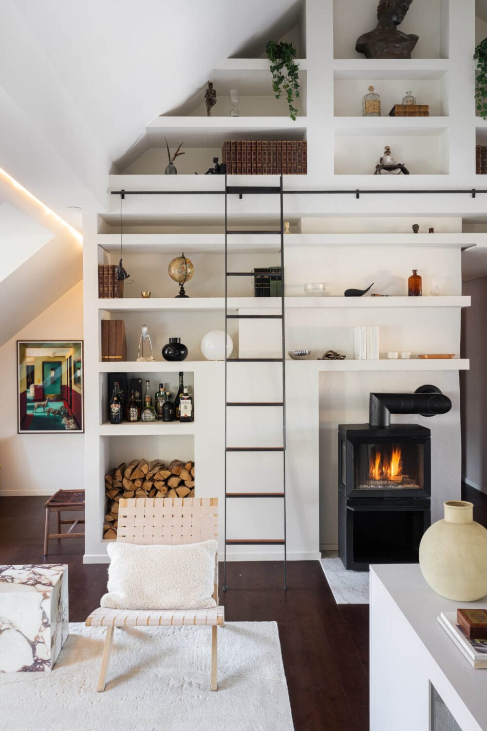 A Light Penthouse Apartment with Built-In Bookshelves 7 built-in bookshelves under slanted ceiling