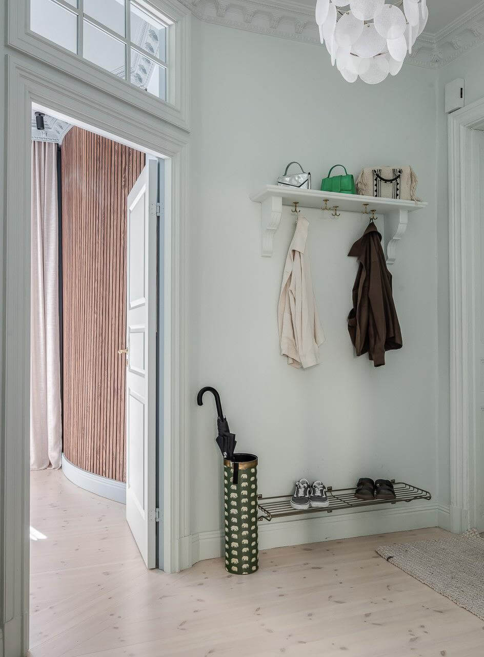 Pastel Colors and Contemporary Design in a Late 19th Century Apartment 21 color drenched hall hat rack