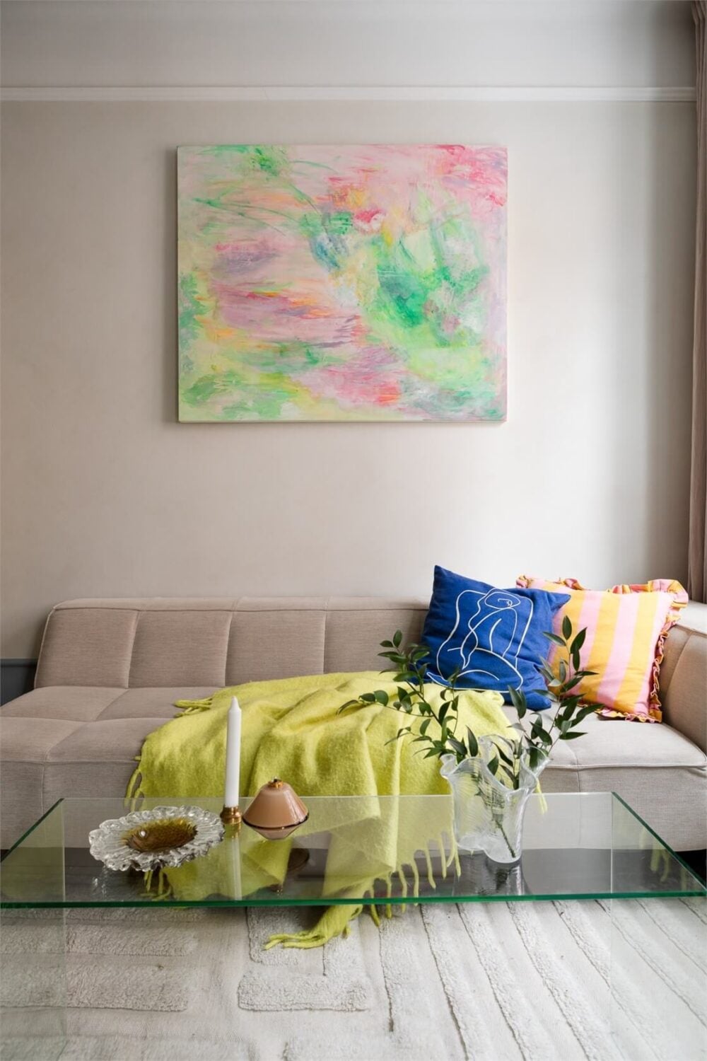 A Small Stockholm Apartment with a Blue Shaker Kitchen 5 colorful art and textiles