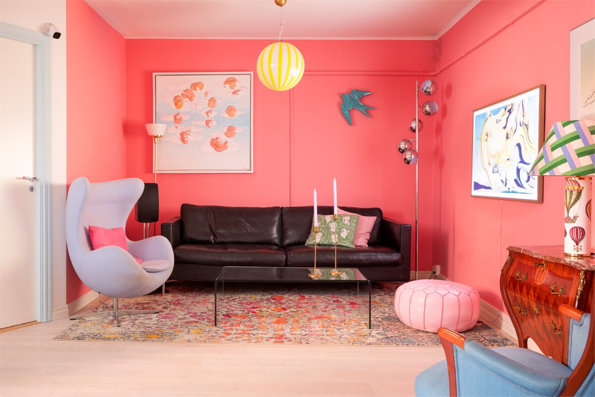 A Colorful Basement Duplex Apartment in Stockholm 5 coral pink walls living room