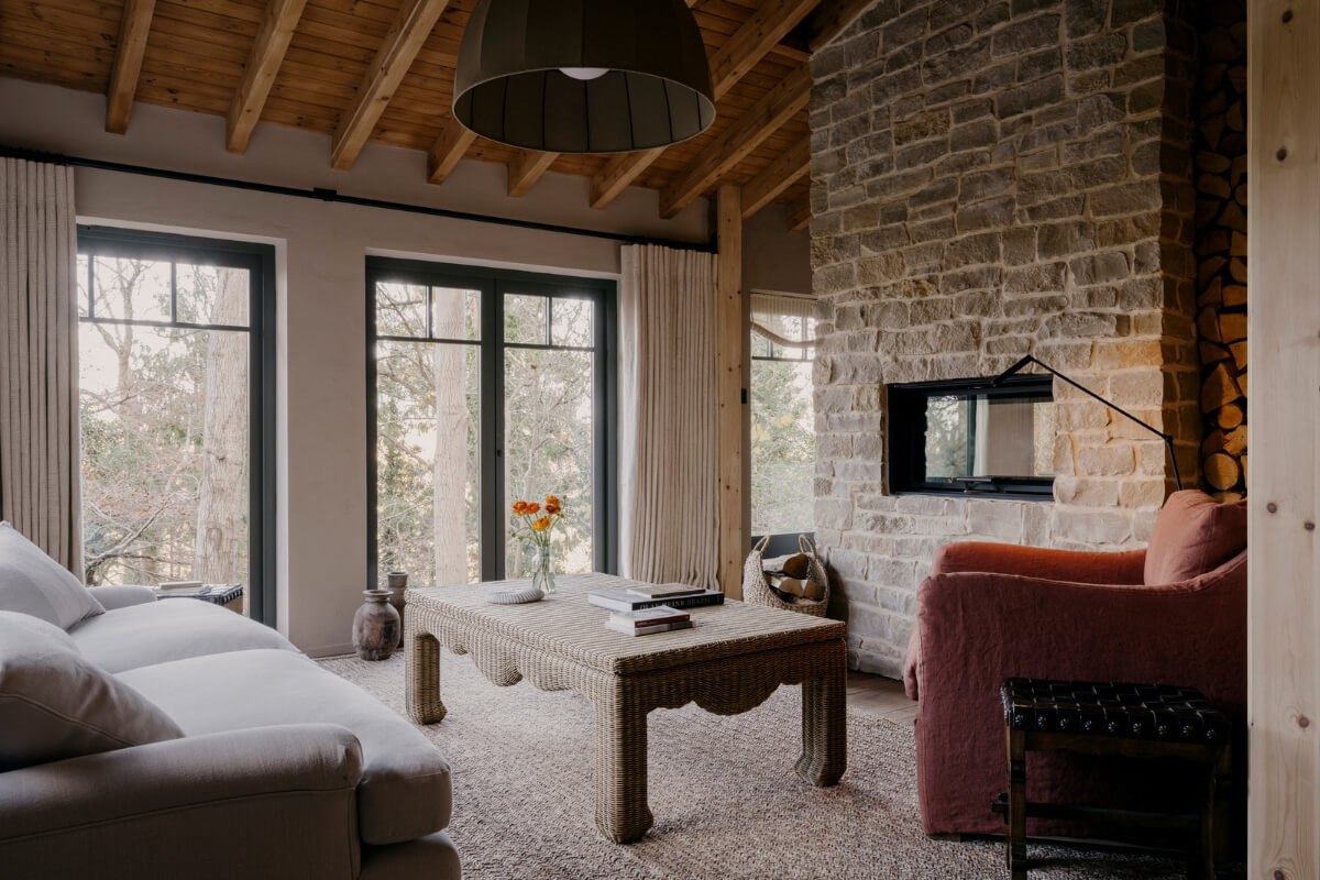 A Cozy and Contemporary Take on a Traditional Log House 4 cozy sitting room brick wall