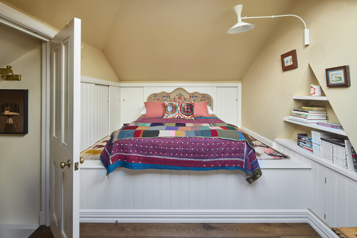 A Renovated Early Victorian Townhouse Decorated in Green Tones 17 dark beige bedroom raised bed