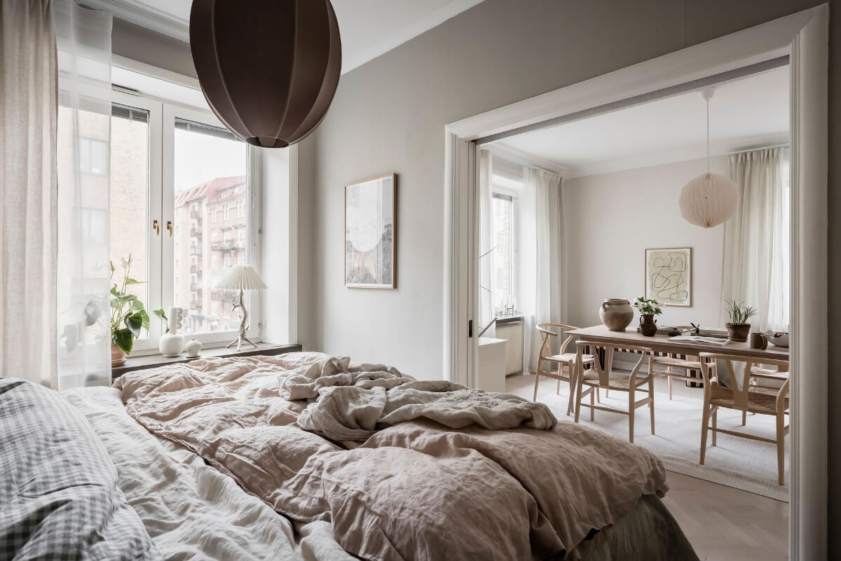 A Light Corner Apartment with an Open Flowing Floor Plan 31 dark beige bedroom sliding doors