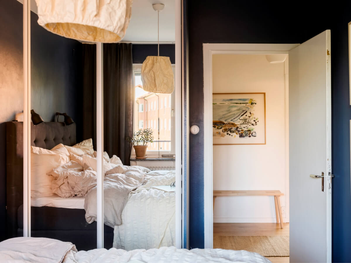 Cozy Plant-Filled Interiors in a 1940s Apartment 19 dark blue bedroom mirror wardrobes