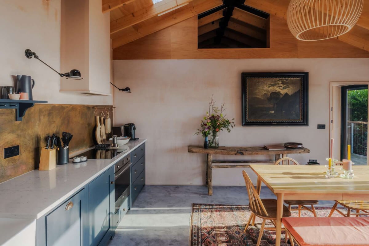 A Japanese-Inspired Timber Home with Views of a Lush Valley 4 dark blue devol kitchen