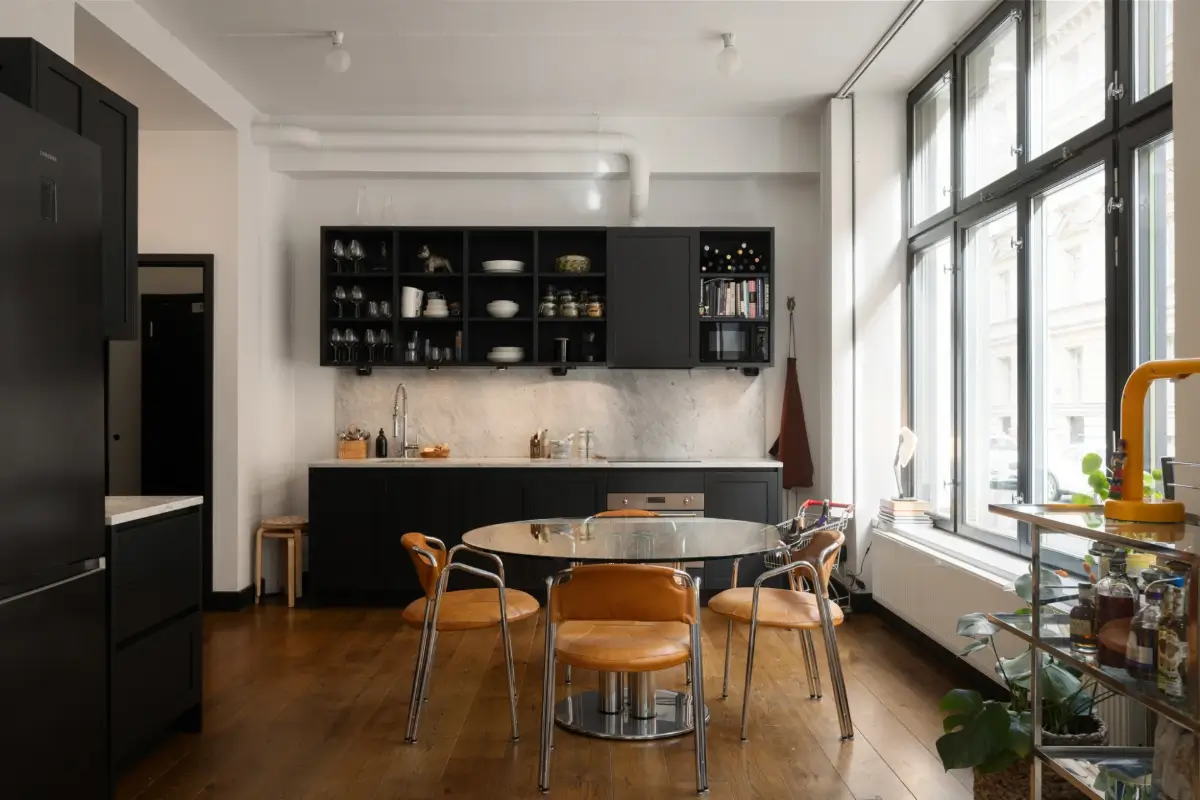 An Apartment with a Mirror Wall in a Former Stockholm Factory 12 dark gray kitchen open cabinets