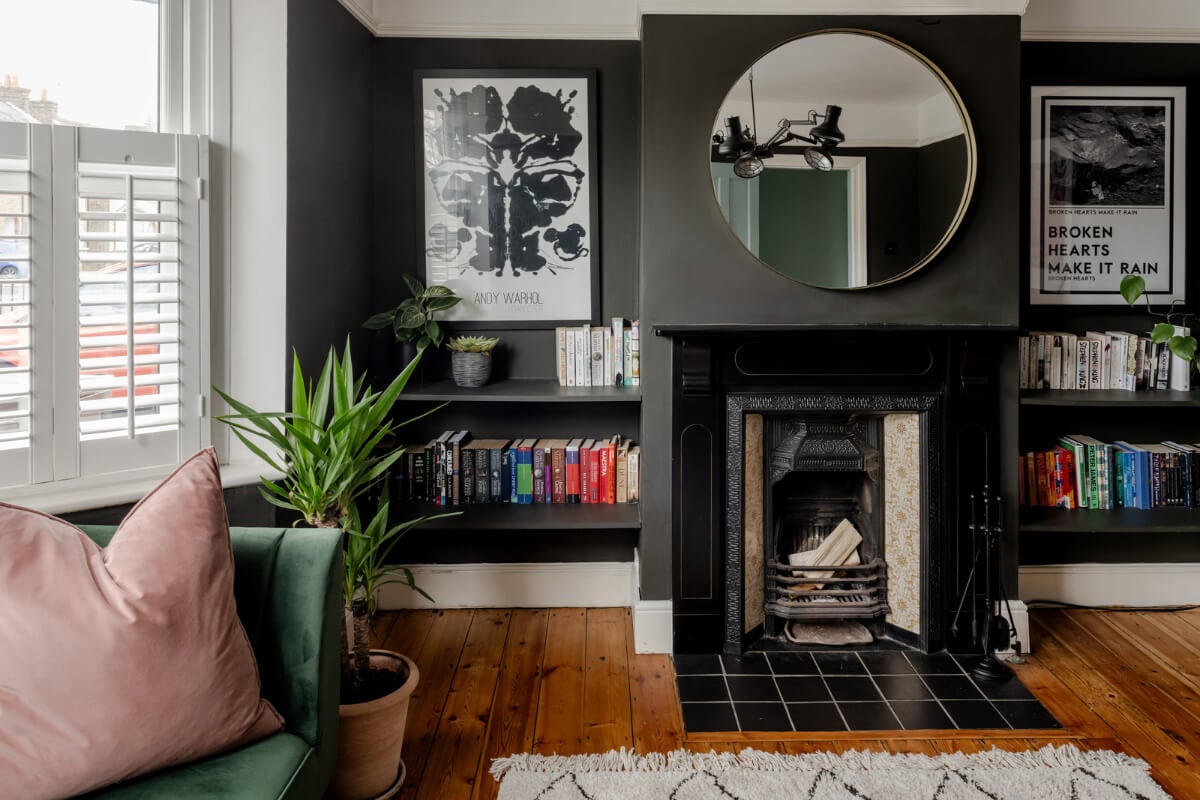 A Contrasting Color Palette in a Renovated Terrace House 2 dark gray living room warm wooden floor