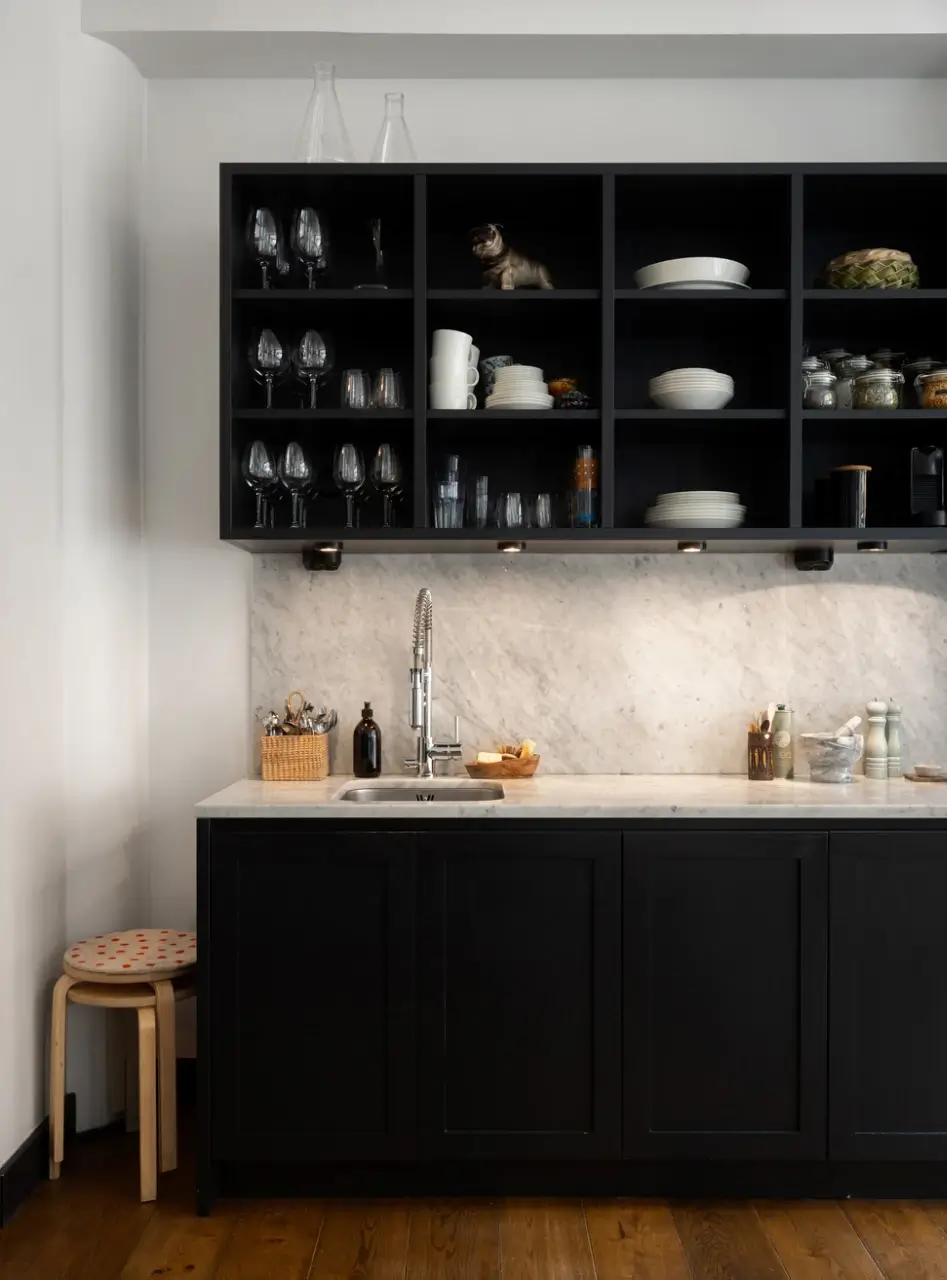 An Apartment with a Mirror Wall in a Former Stockholm Factory 14 dark kitchen open upper cupboards