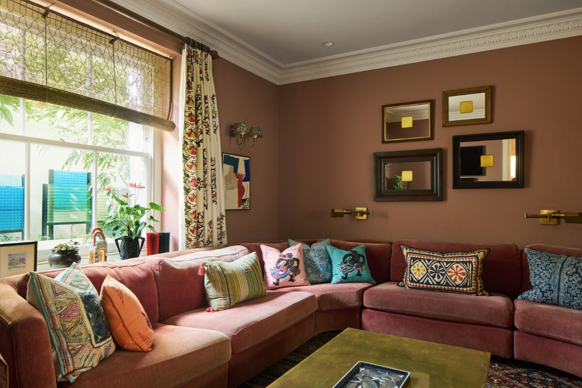 A Renovated Early Victorian Townhouse Decorated in Green Tones 1 dark pink sitting room large sofa