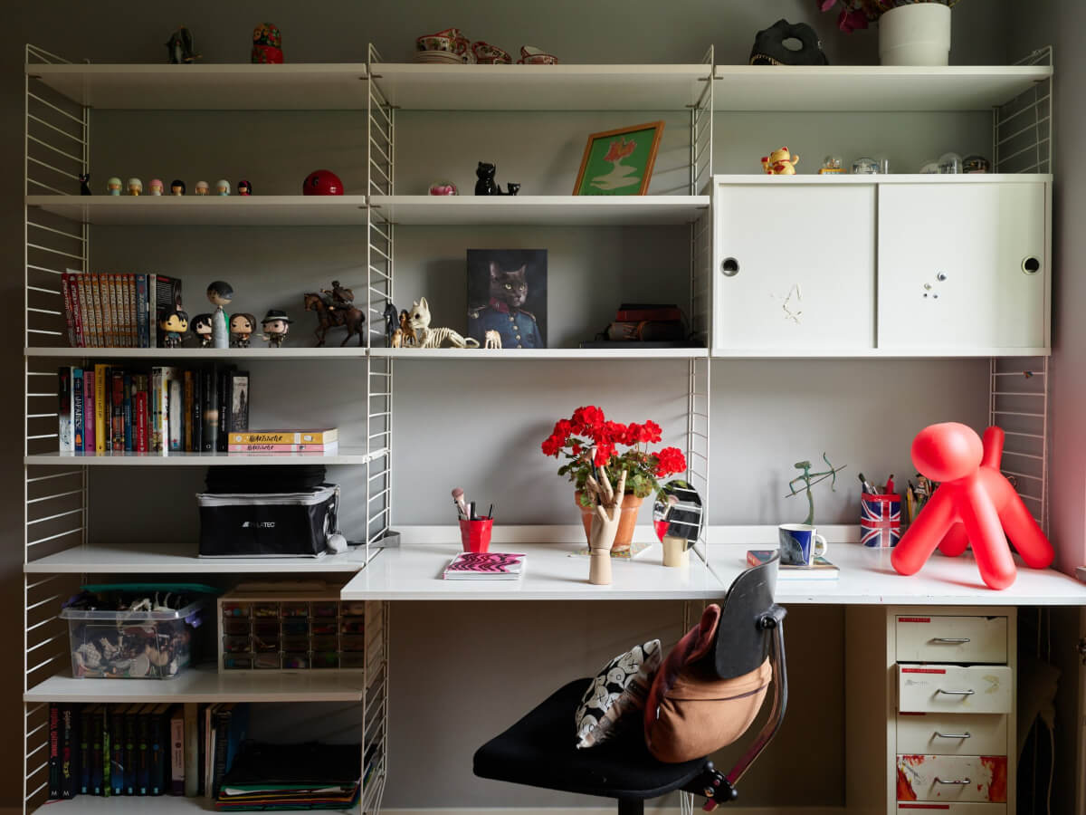 A Lovely Color Palette in a Midcentury Apartment in Sweden 27 desk and shelves made of string shelves