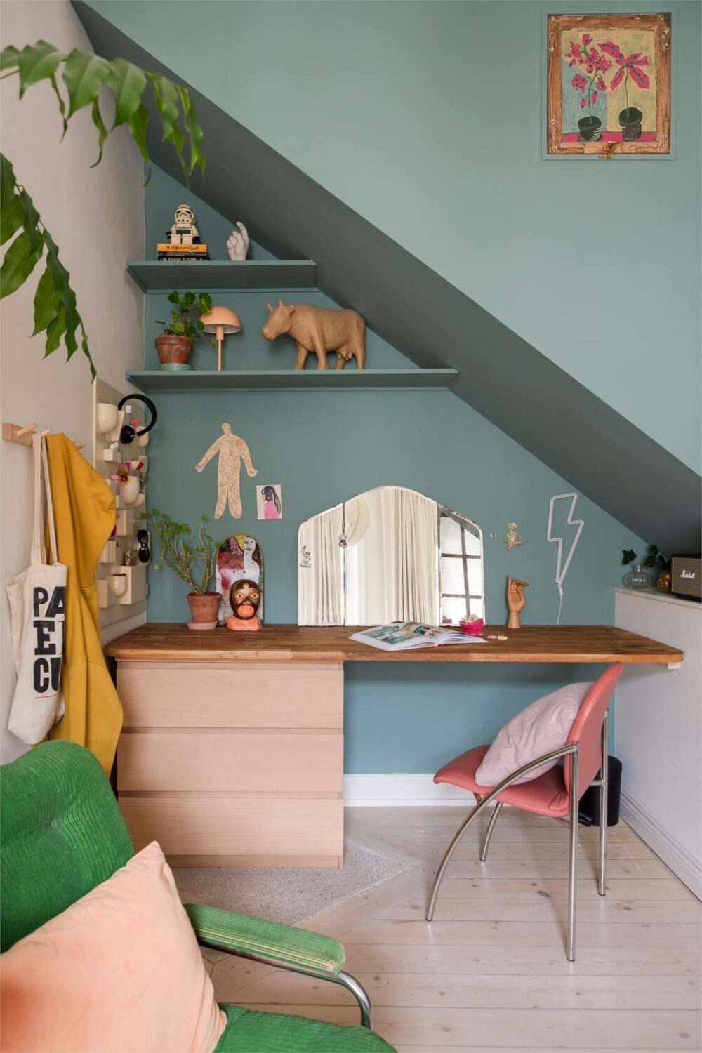 A Colorful Family Attic Apartment in Stockholm 39 desk under slanted ceiling