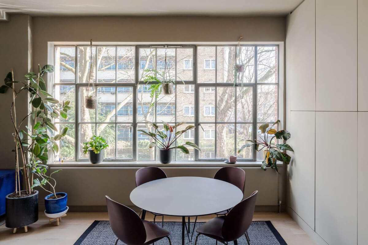Soft-Colored Contemporary Interiors in a Warehouse Apartment 10 dining area large windows