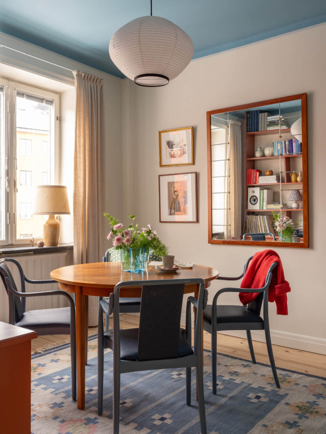 A Beautiful Well-Preserved 1930s Apartment with a Blue Kitchen 10 dining room round table blue ceiling