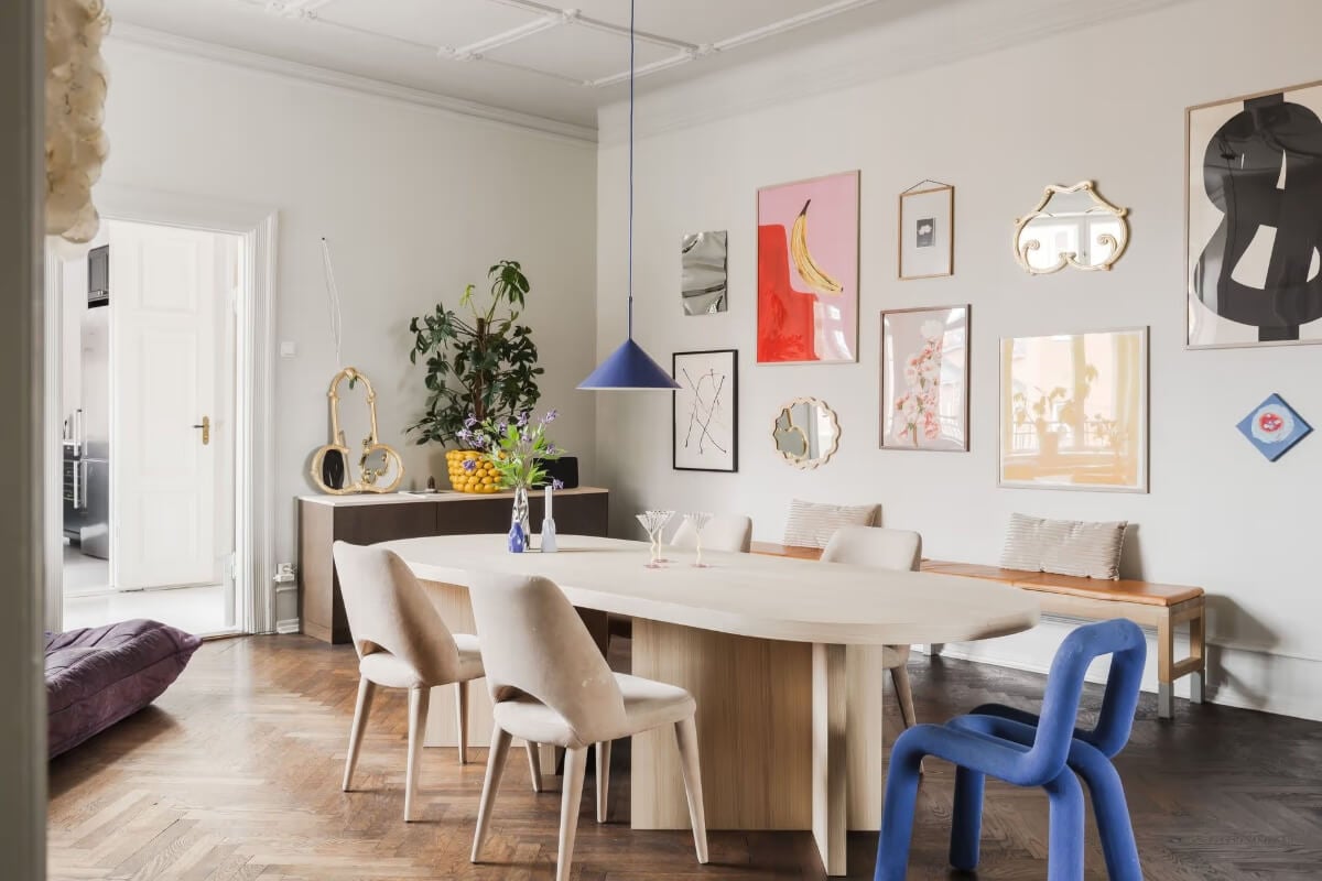 Grand Rooms and Period Features in a Malmö Apartment 9 dining room with art