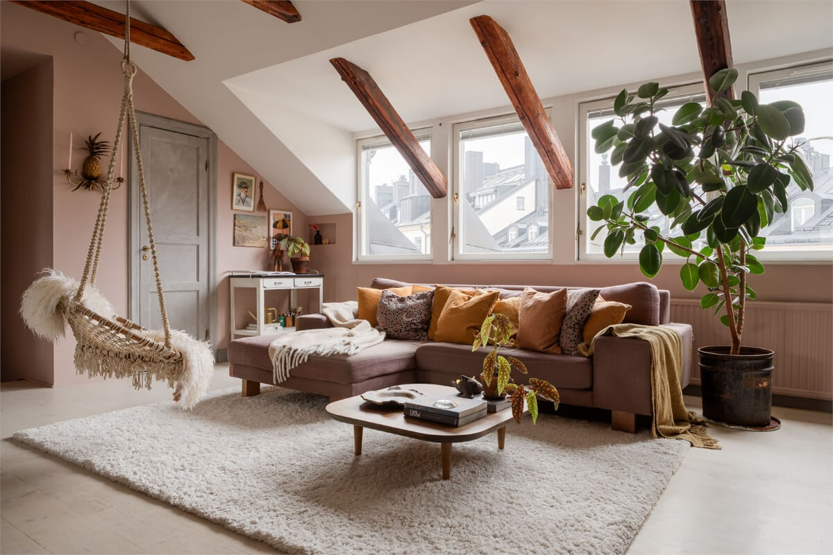 A Colorful Family Attic Apartment in Stockholm 5 dormer windows attic room pink walls wooden beams
