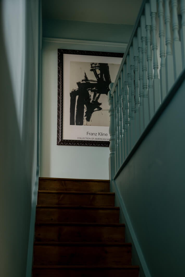 A Contrasting Color Palette in a Renovated Terrace House 9 dusty blue staircase