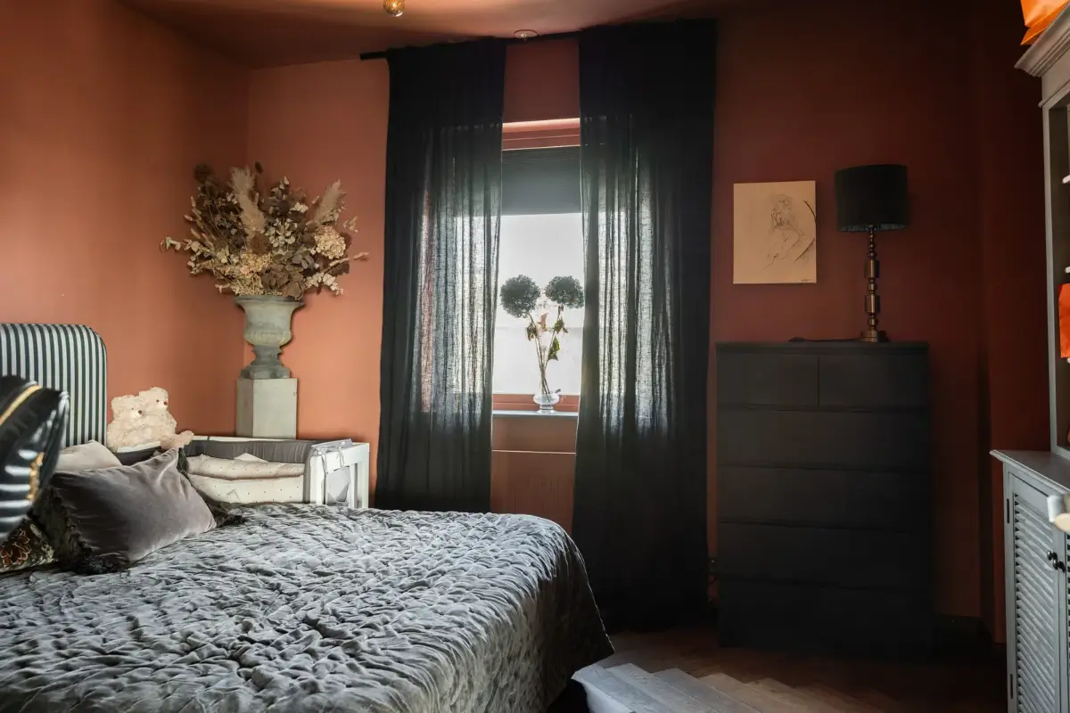 A Top Floor Swedish Apartment with a Huge Balcony 17 earthy pink bedroom striped headboard