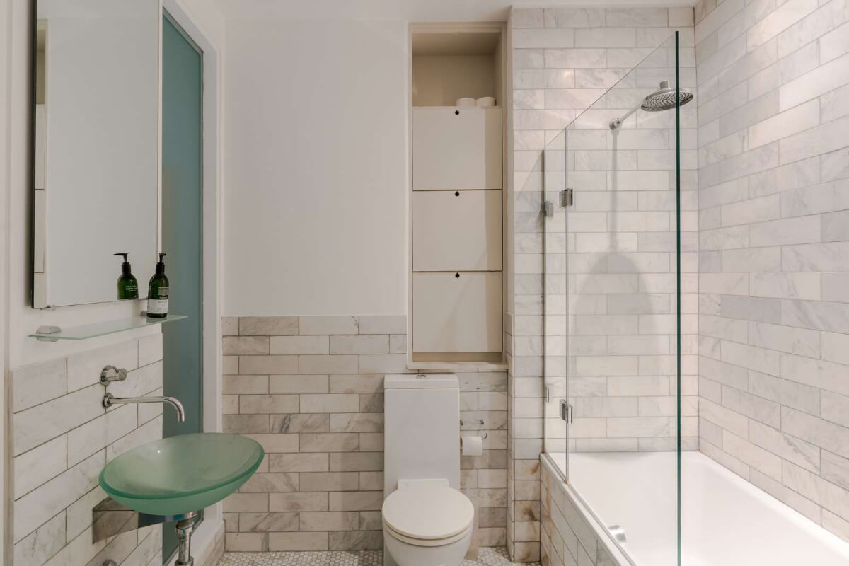 Soft-Colored Contemporary Interiors in a Warehouse Apartment 21 en suite bathroom green glass sink Soft-Colored Contemporary Interiors in a Warehouse Apartment