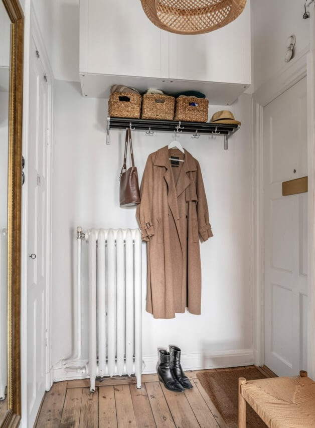 A Small Light-Filled Apartment with a Pink Bedroom 21 entry hall high cabinets