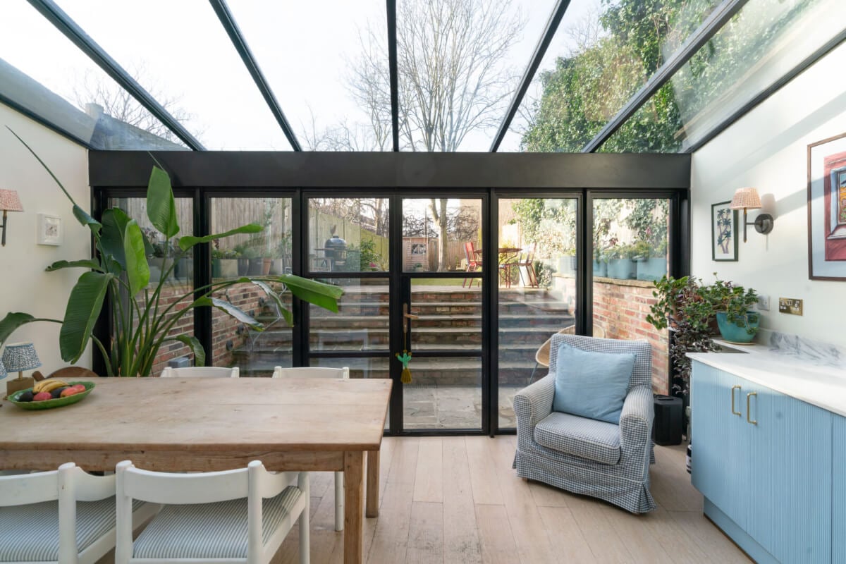 A Bright Victorian House with Plaster Walls and Blue Rooms 11 extended kitchen space with dining table