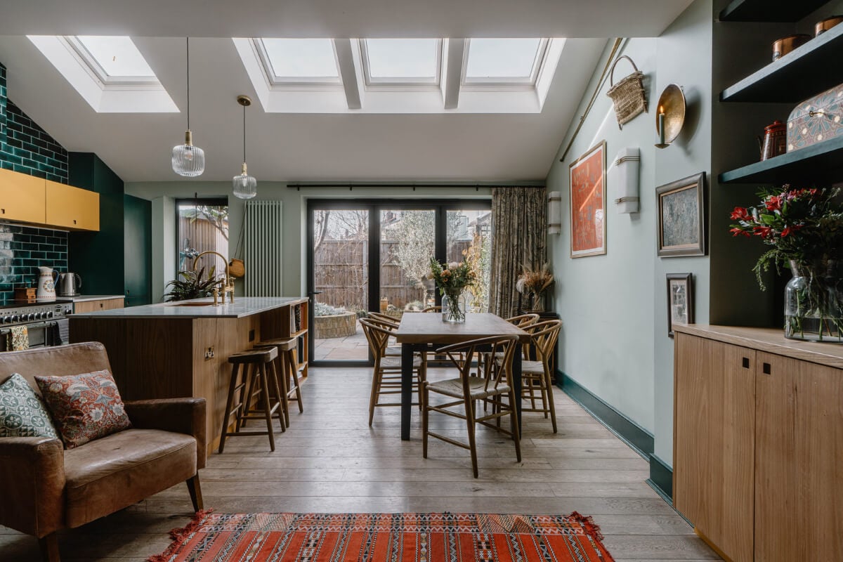 Moroccan-Inspired Designs in a Unique Artist Family Home in London 6 extended kitchen with island green tiles
