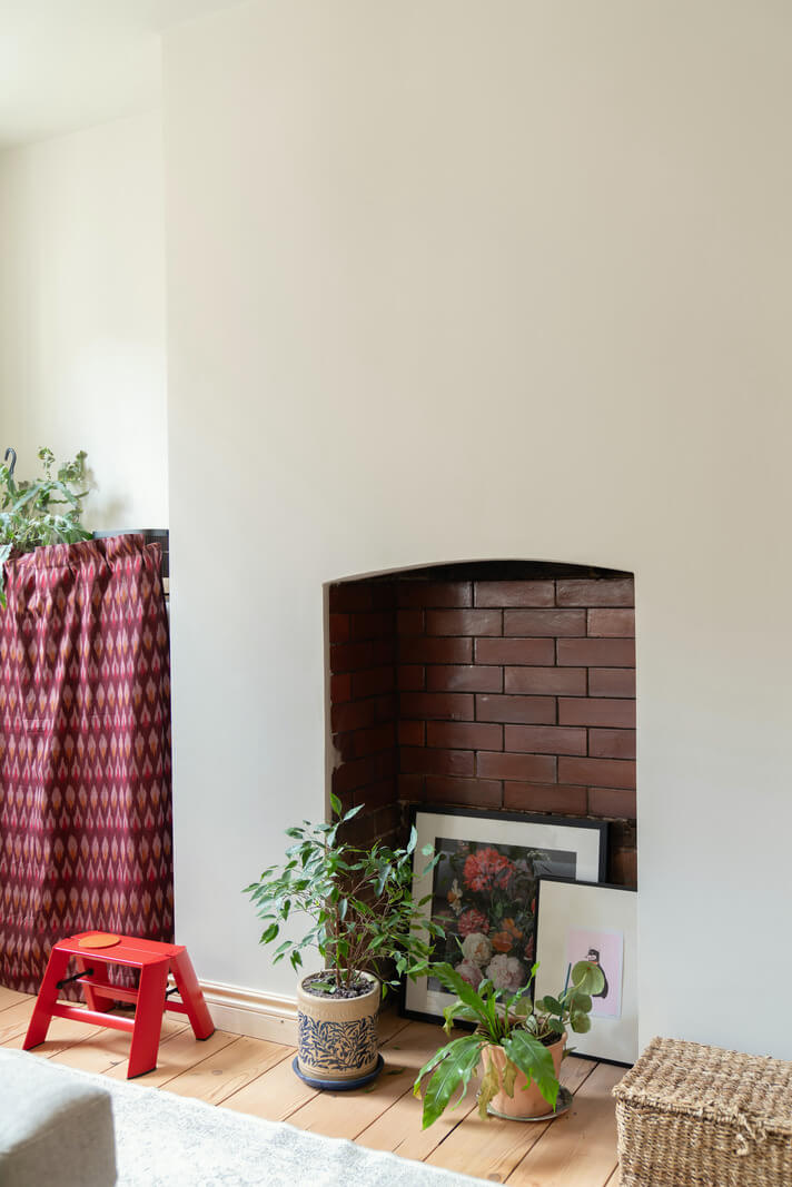 A Tiny Apartment with a Yellow Kitchen in London 6 fireplace mantel tilework