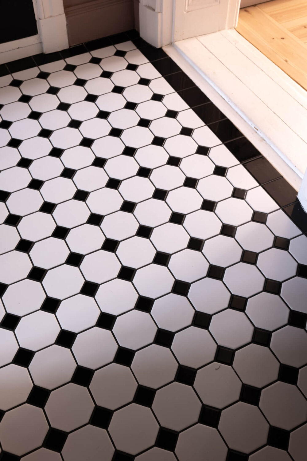 A Small Apartment Decorated in a Light Gray & White Color Palette 22 floor tiles