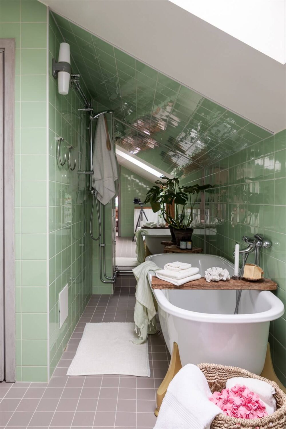 A Colorful Family Attic Apartment in Stockholm 32 freestanding bath green tiles