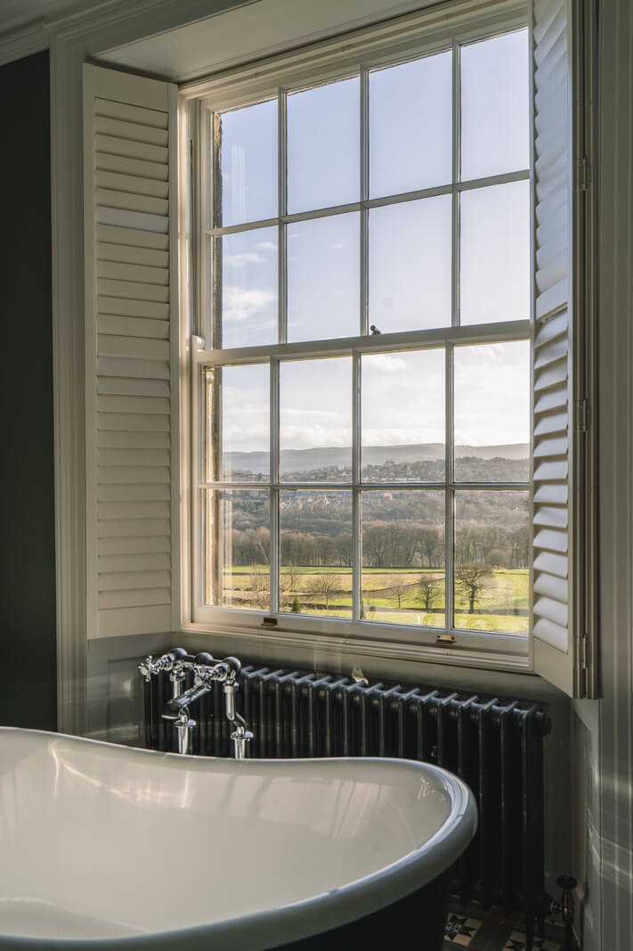Colorful Rooms in a Regency Manor House in Yorkshire 12 freestanding bath under window
