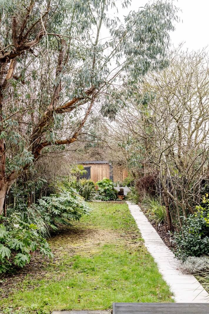 A Contrasting Color Palette in a Renovated Terrace House 18 garden large trees