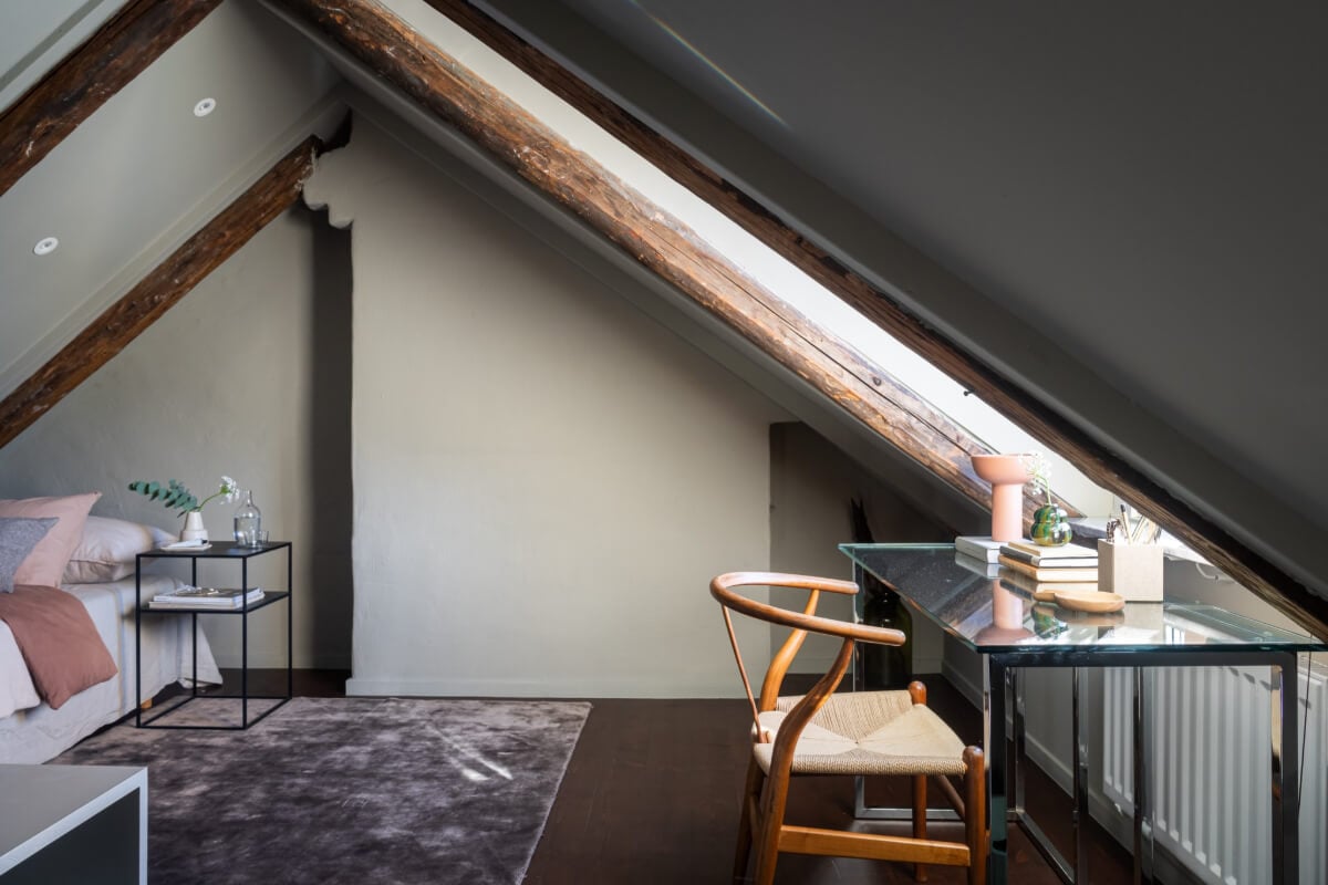 A Light Penthouse Apartment with Built-In Bookshelves 28 glass desk under window