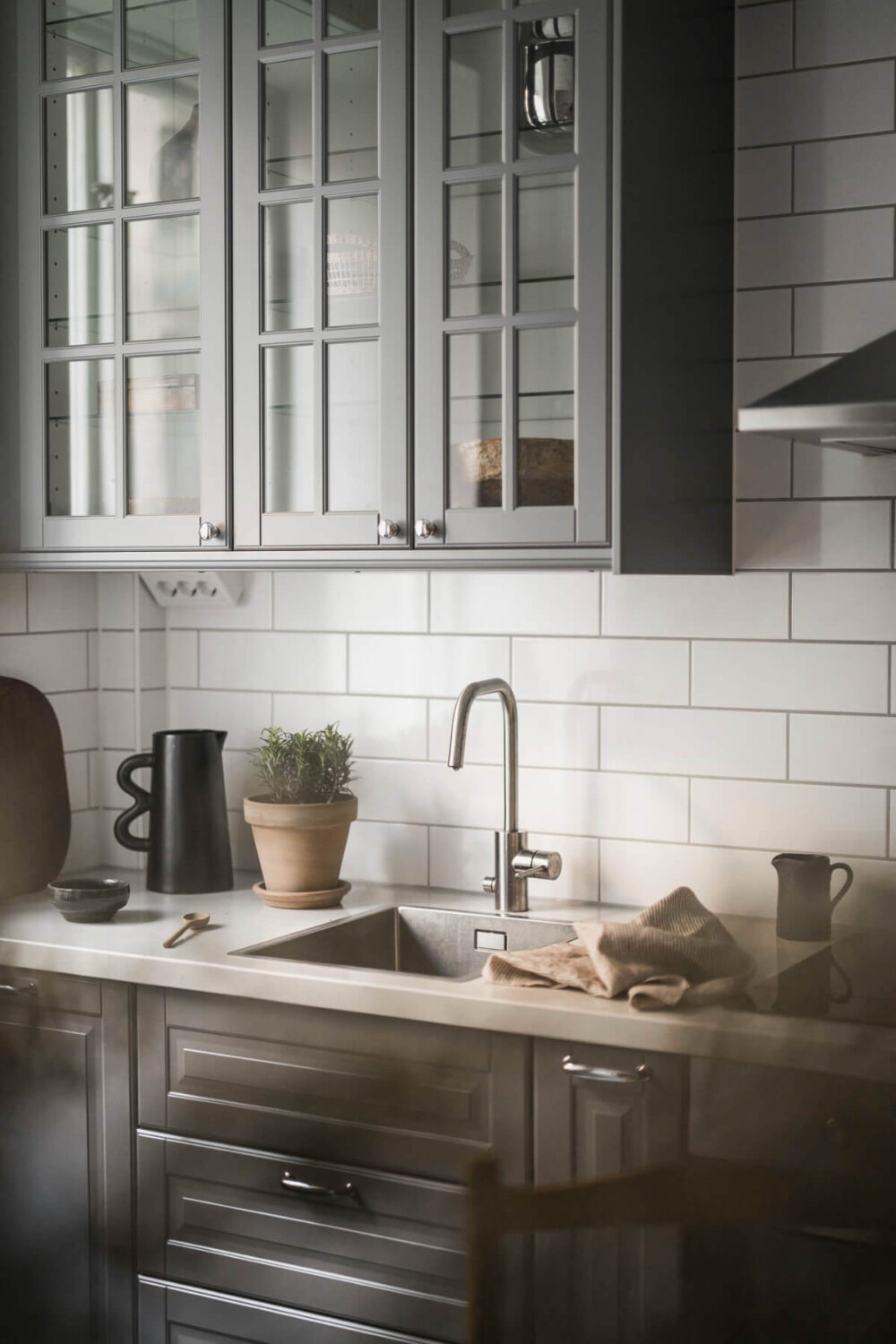 A Light Swedish Studio in an Early 20th Century Building 13 glass fronted cabinets
