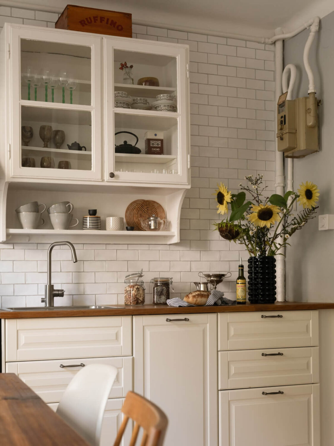 A Charming One-Bedroom Apartment in a 1920s Building 18 glass upper cabinet