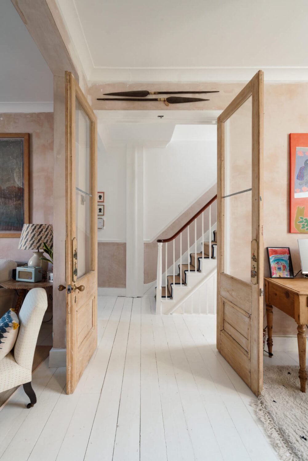 A Bright Victorian House with Plaster Walls and Blue Rooms 6 glass wooden doors