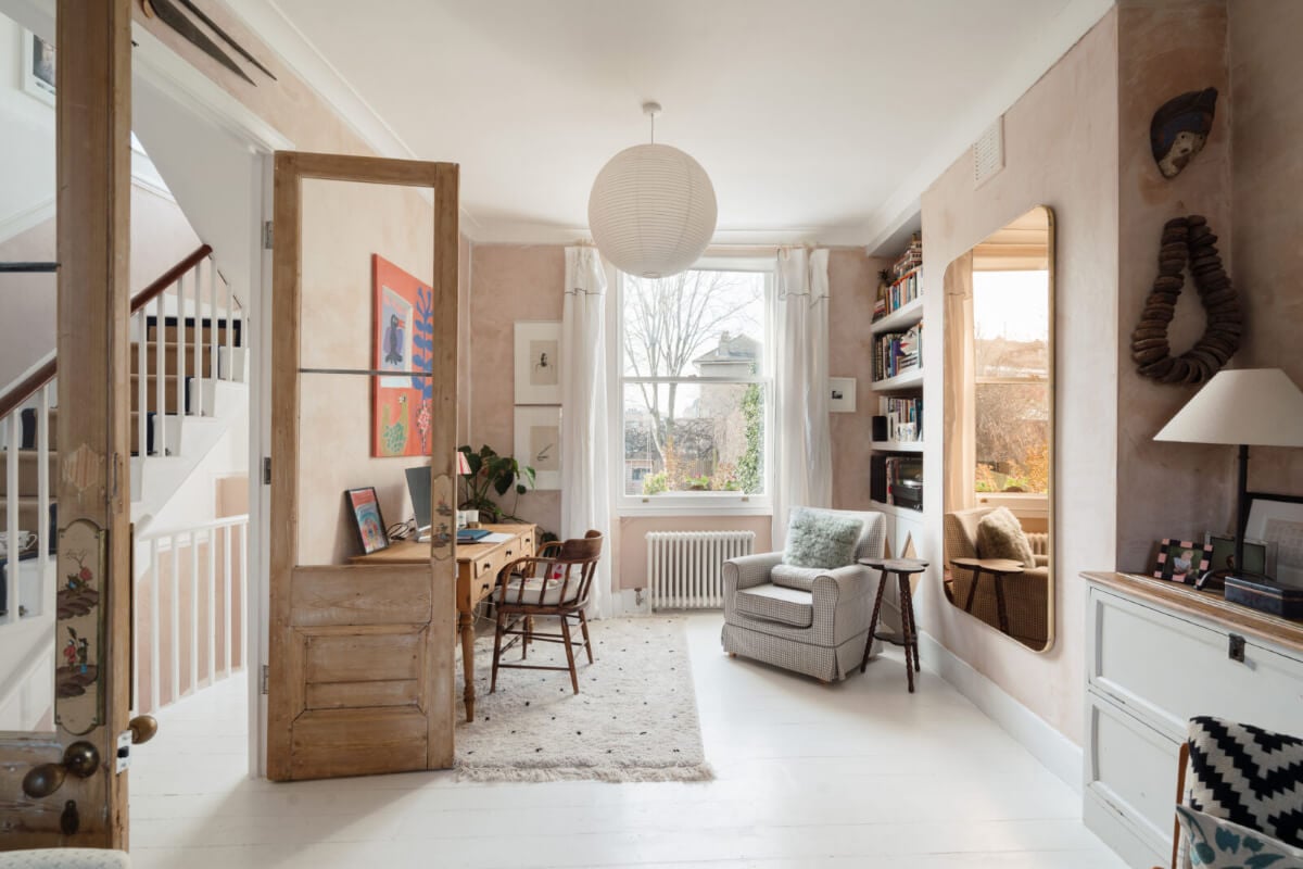 A Bright Victorian House with Plaster Walls and Blue Rooms 5 glass wooden doors bright living space