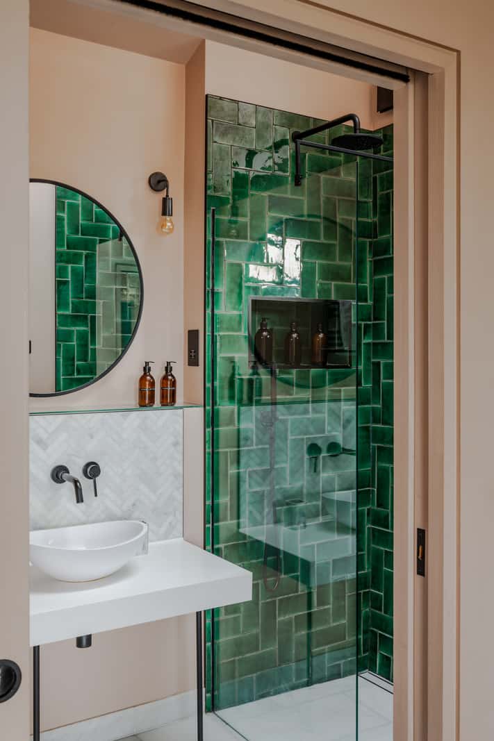 A Japanese-Inspired Timber Home with Views of a Lush Valley 15 glossy green tiles small bathroom