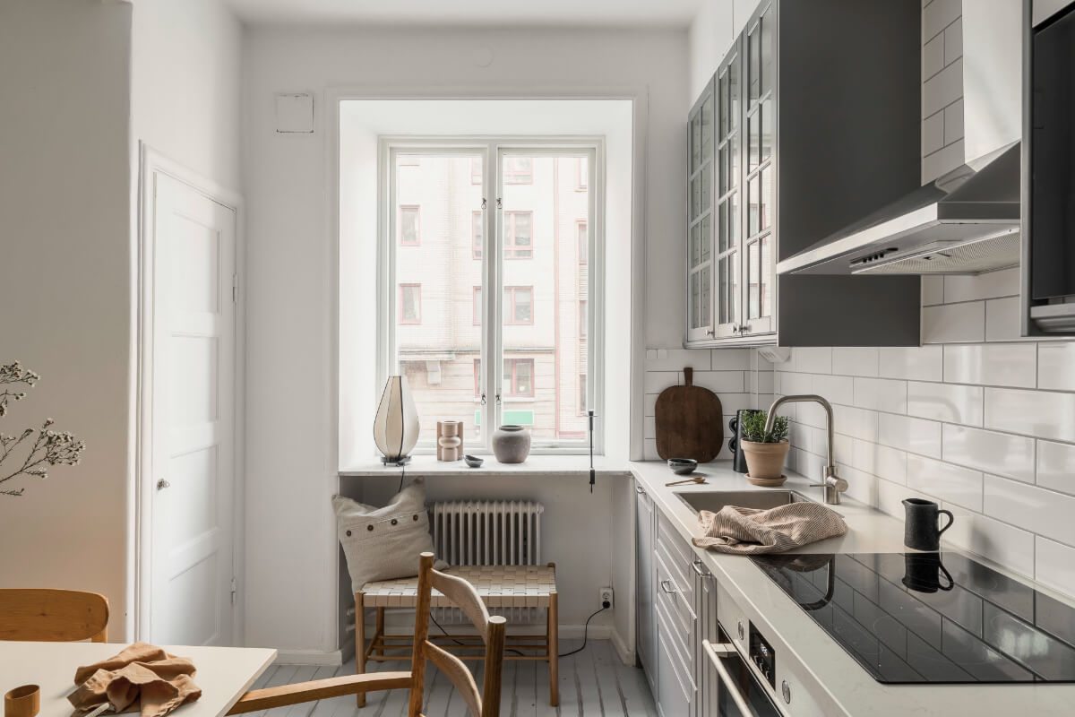 A Light Swedish Studio in an Early 20th Century Building 15 gray and white kitchen window seat