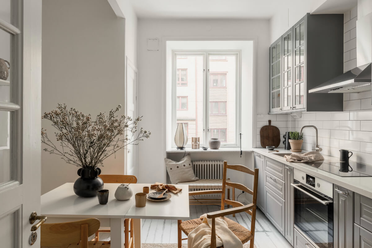 A Light Swedish Studio in an Early 20th Century Building 11 gray and white kitchen