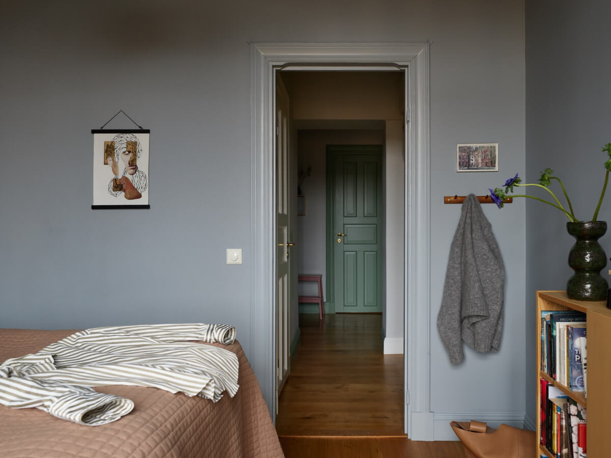Lovely Color Combinations in a Charming One-Bedroom Apartment 21 gray bedroom view into hall