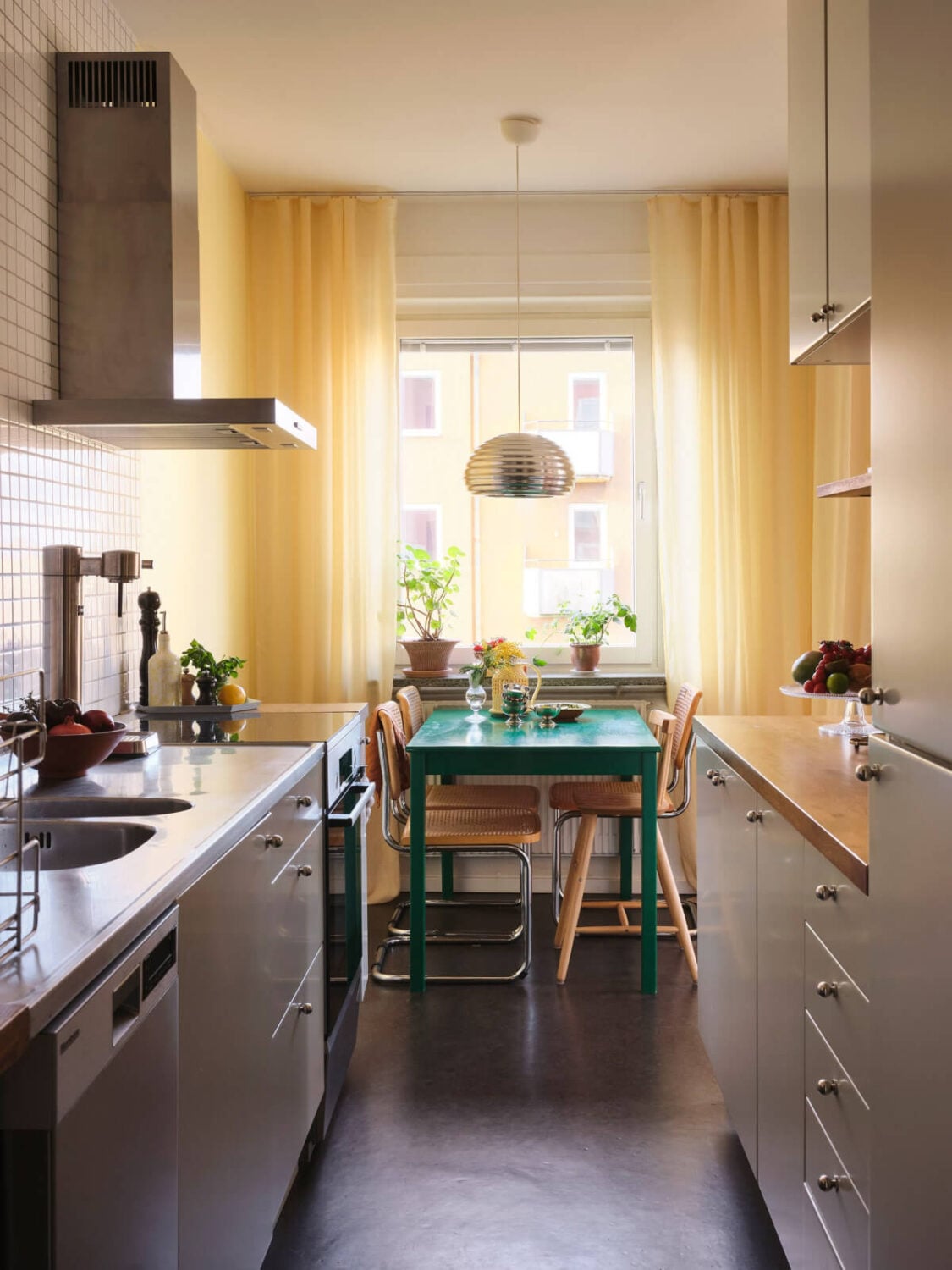 A Light Corner Apartment with Yellow Color Accents 13 gray kitchen dining table yellow curtains