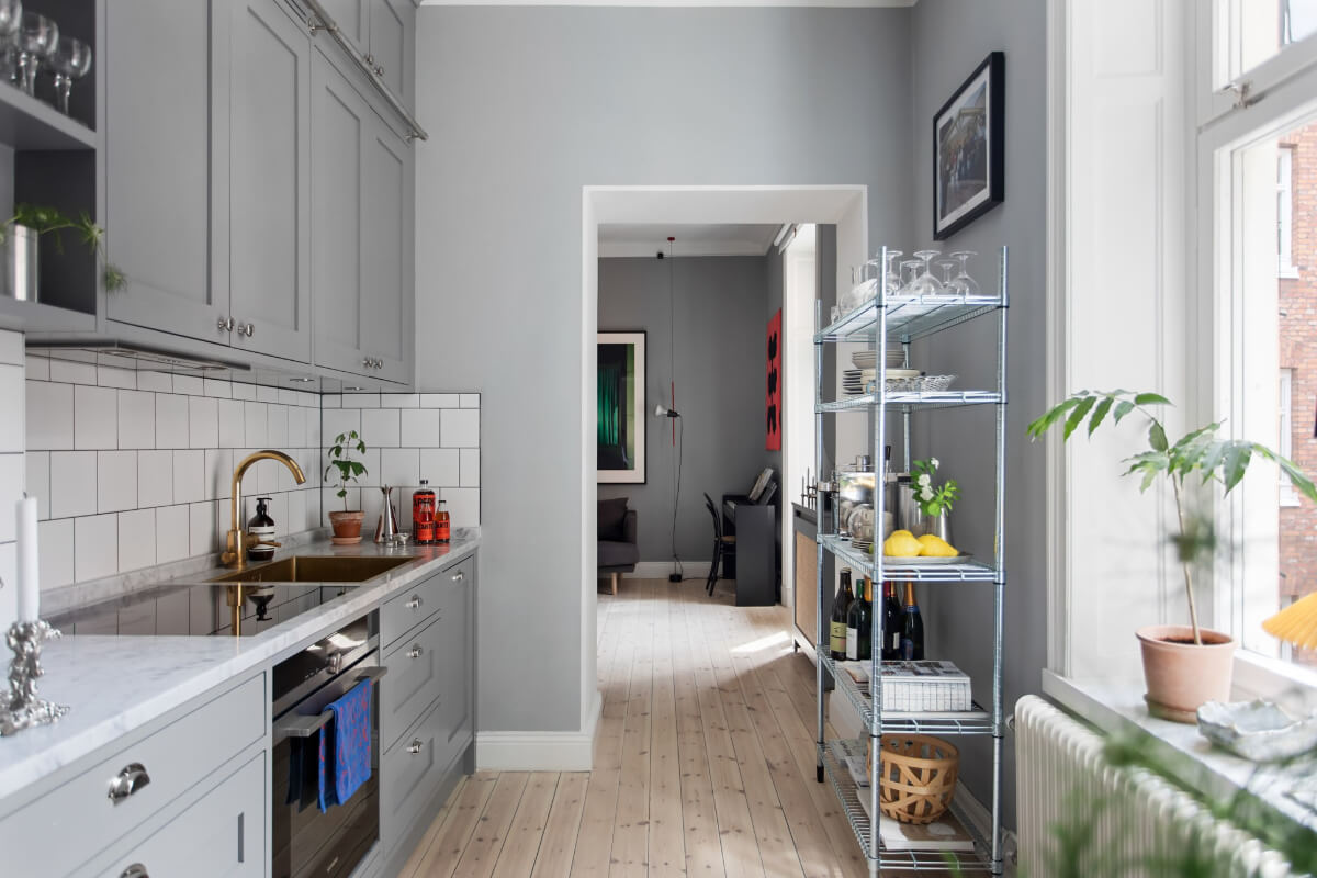 A Gray Studio Apartment with an Industrial Room Divider 10 gray kitchen marble countertop white tiles