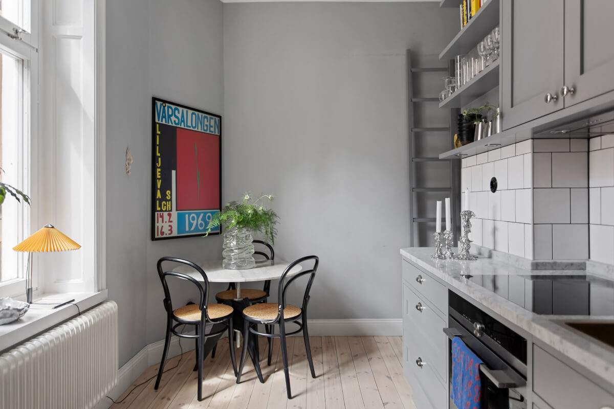 A Gray Studio Apartment with an Industrial Room Divider 13 gray kitchen round table